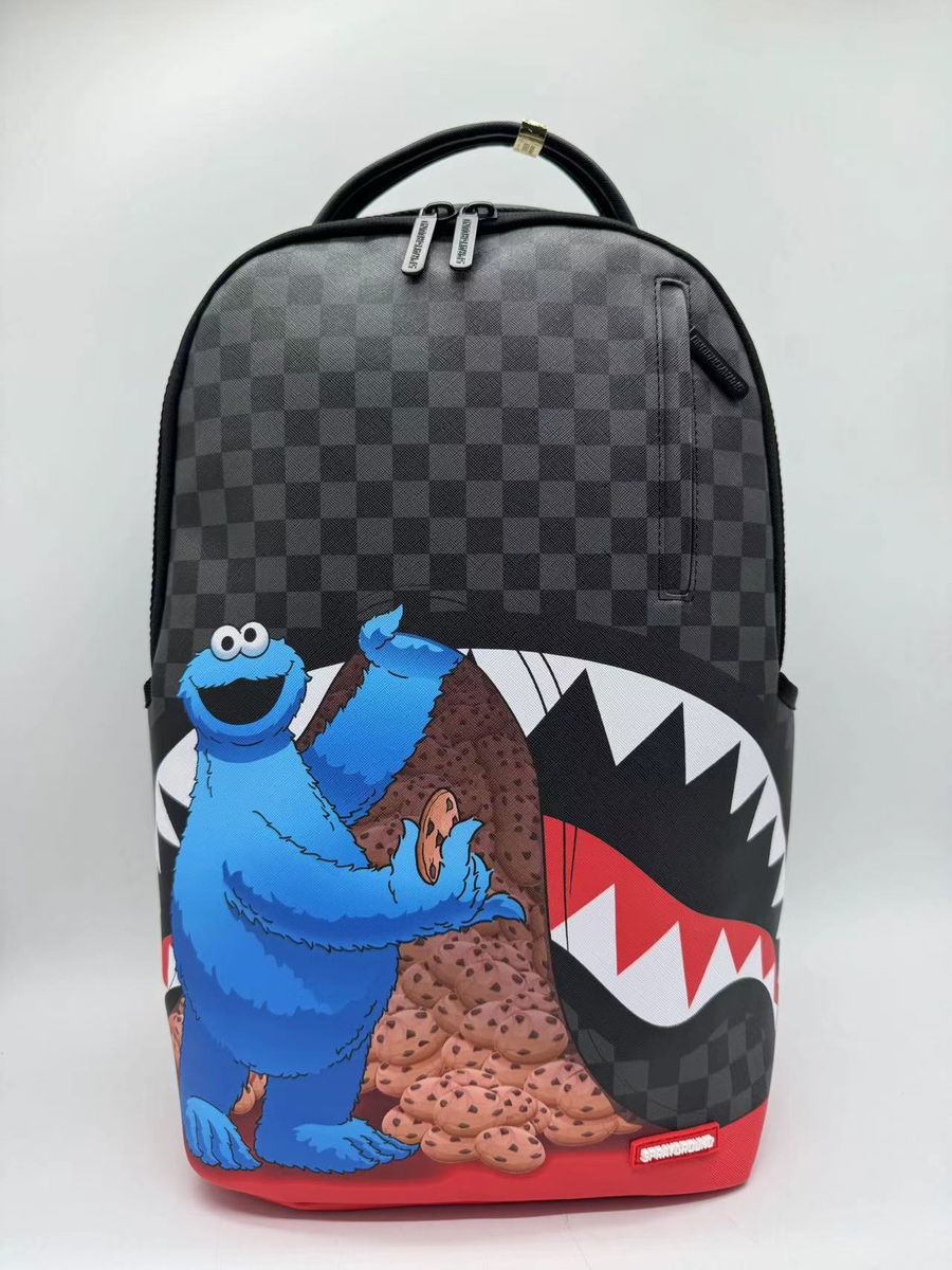 SESAME STREET COOKIE MONSTER SNEAKING A BITE DLXSV BACKPACK